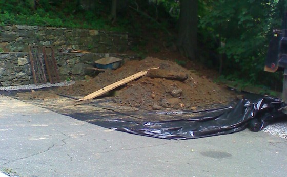 Contaminated soil stock piled on poly